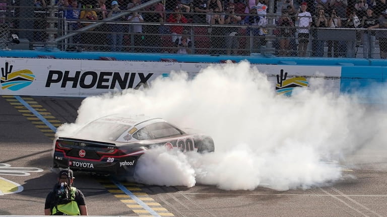 Christopher Bell does a burnout after his NASCAR Cup Series...