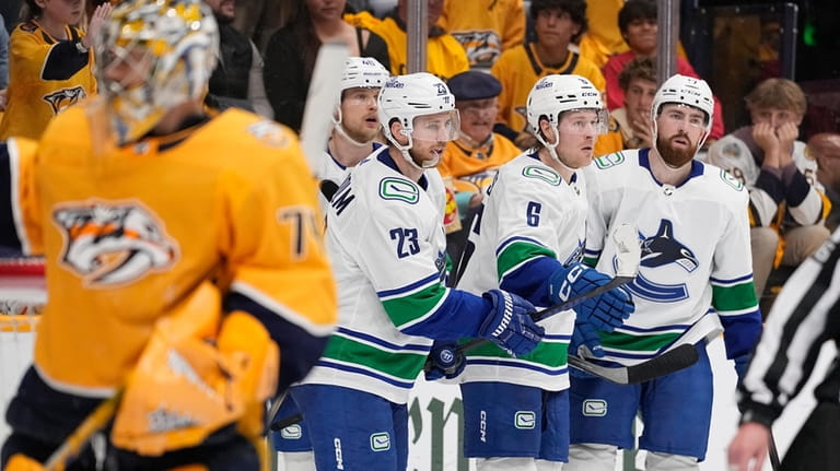 Vancouver Canucks right wing Brock Boeser (6) celebrates his goal...