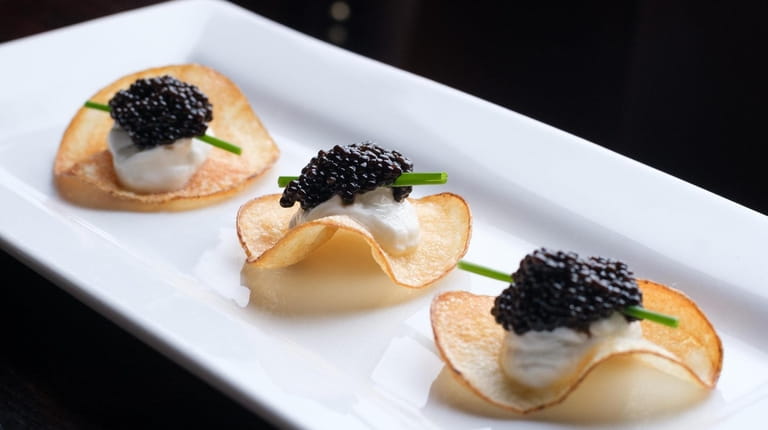 "Million-dollar potato chips" are topped with caviar at Maroni Cuisine...