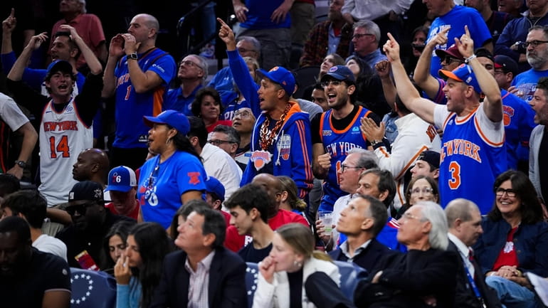 Knicks fans cheer during the second half in Game 6...