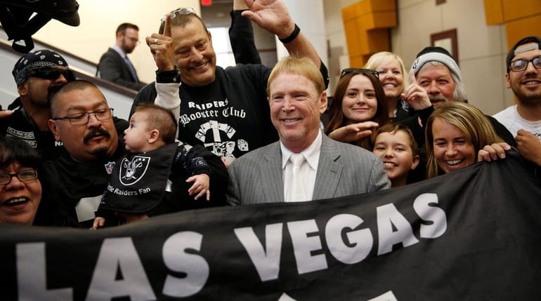 Oakland Raiders owner Mark Davis, center, meets with Raiders fans...