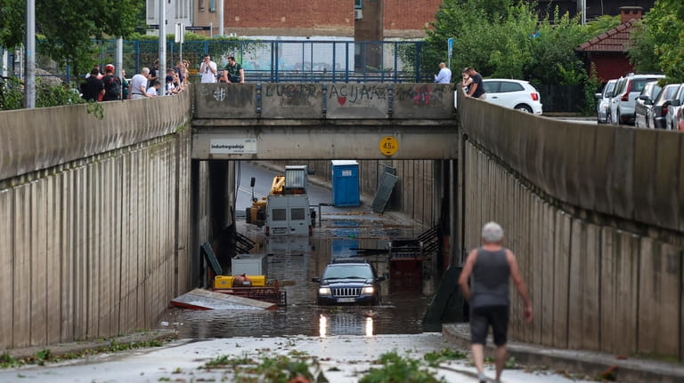 People check the damage after a powerful storm, in Zagreb,...