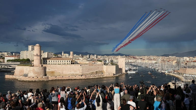 The Patrouille de France aerobatics demonstration aircraft leave a tricolor...