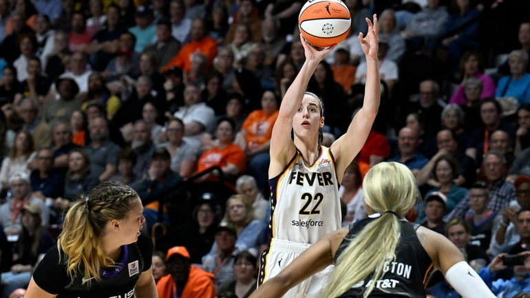 Indiana Fever guard Caitlin Clark (22) puts up a 3-point...