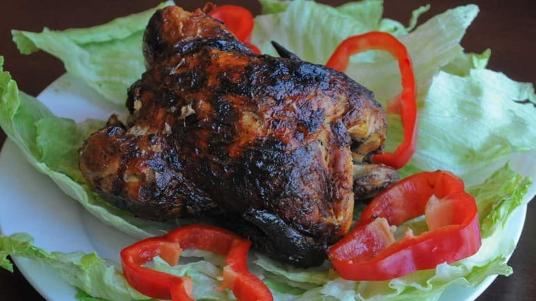 Rotisserie chicken served at La Cocina de Marcia restaurant on...