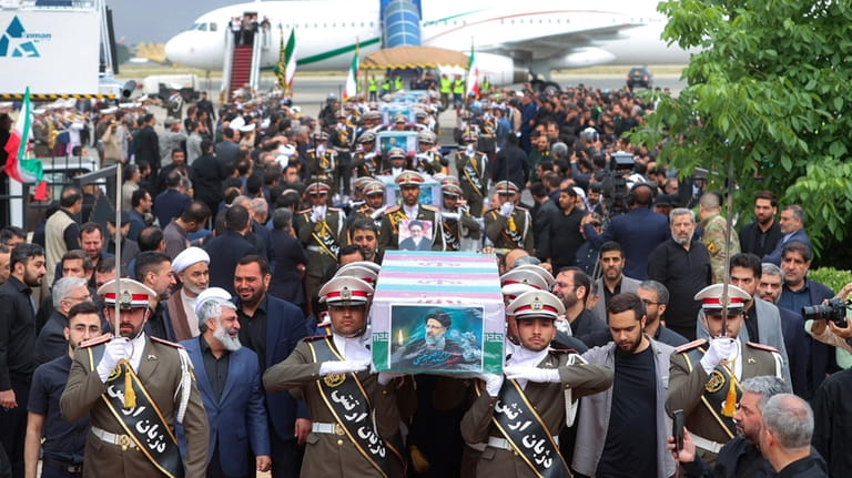 In this photo released by the Iranian Presidency Office, army...