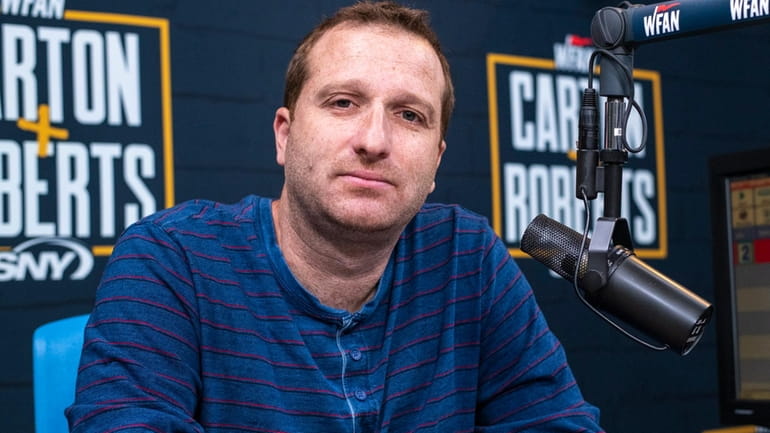 Evan Roberts sits in WFAN's redesigned studio for the "Carton...