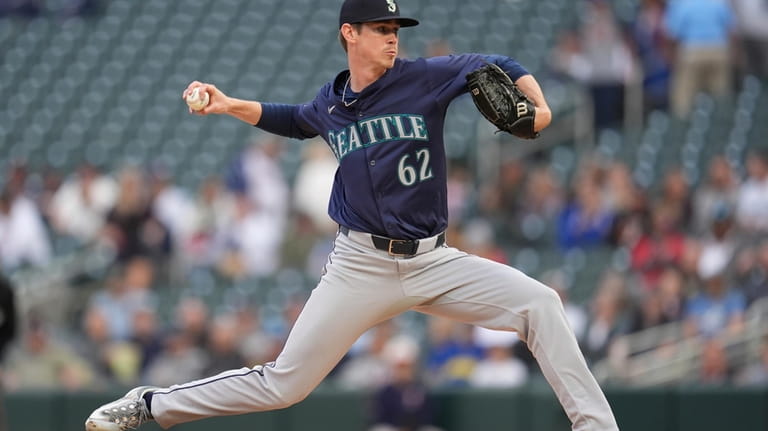 Seattle Mariners starting pitcher Emerson Hancock (62) delivers during the...