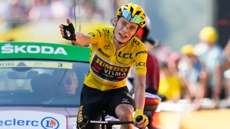 Stage winner Denmark's Jonas Vingegaard, wearing the overall leader's yellow...