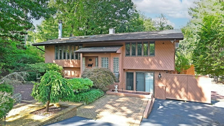 This $715,000 Commack home sits on 0.23 acre.