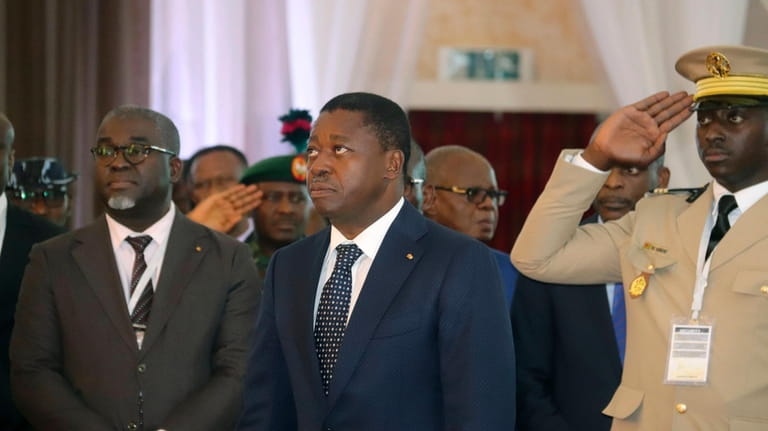 Togo's President, Faure Gnassingbé, centre, looks on, prior to the...