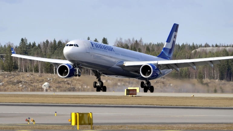 A Finnair plane lands at the Helsinki International Airport in...