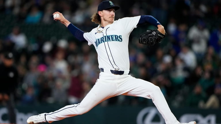 Seattle Mariners starting pitcher Bryce Miller throws against the Atlanta...
