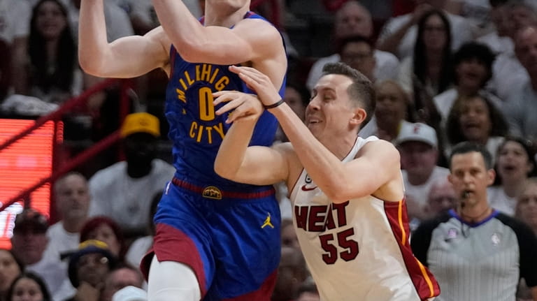 Denver Nuggets guard Christian Braun (0) shoots the ball against the Miami  Heat during the first
