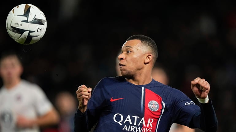 PSG's Kylian Mbappe controls the ball during the French Super...