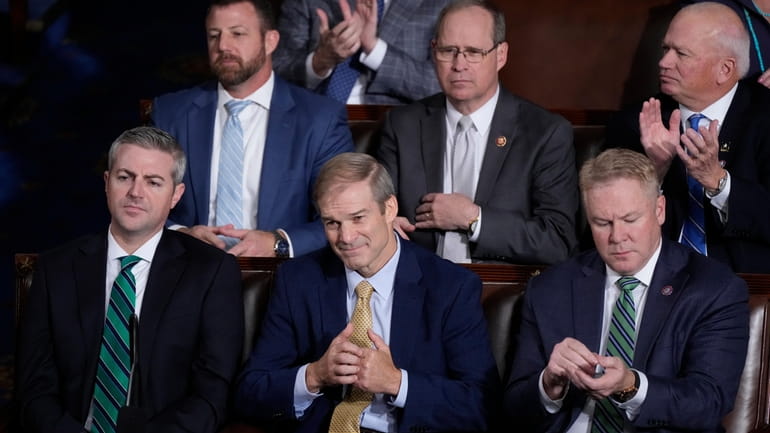 Rep. Jim Jordan (R-Ohio) listens to lawmakers call out their votes...