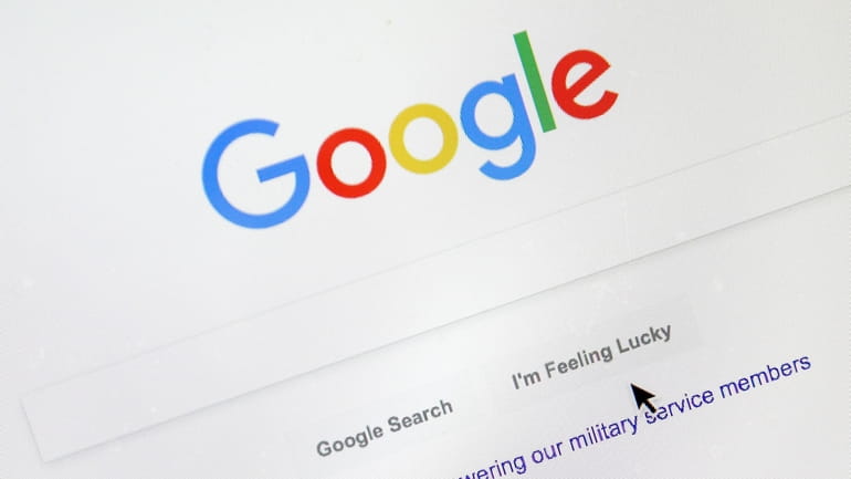 A cursor moves over Google's search engine page, Aug. 28,...