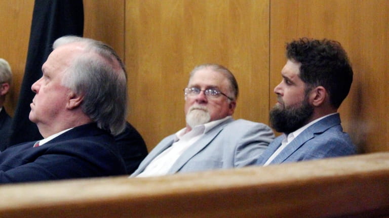 Co-defendants Gregory Case second from right, and his son Brandon...