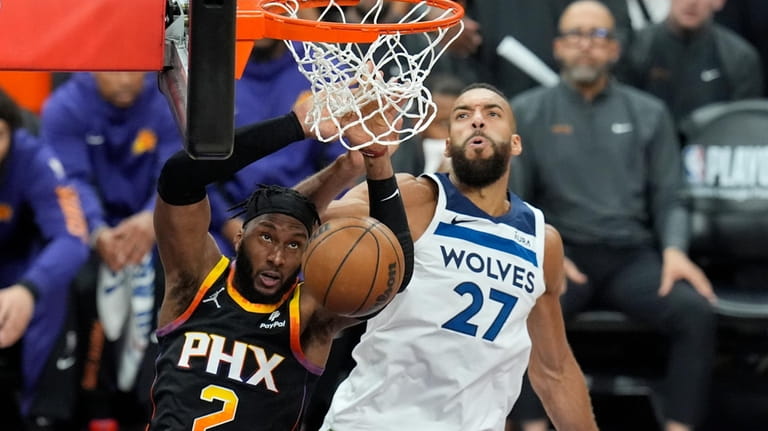 Phoenix Suns forward Josh Okogie (2) dunks against Minnesota Timberwolves...