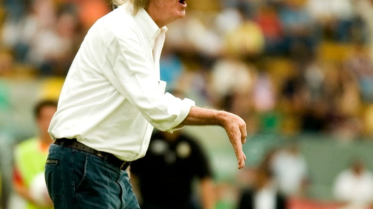 Soccer coach Cesar Luis Menotti, from Argentina, shouts instructions during...