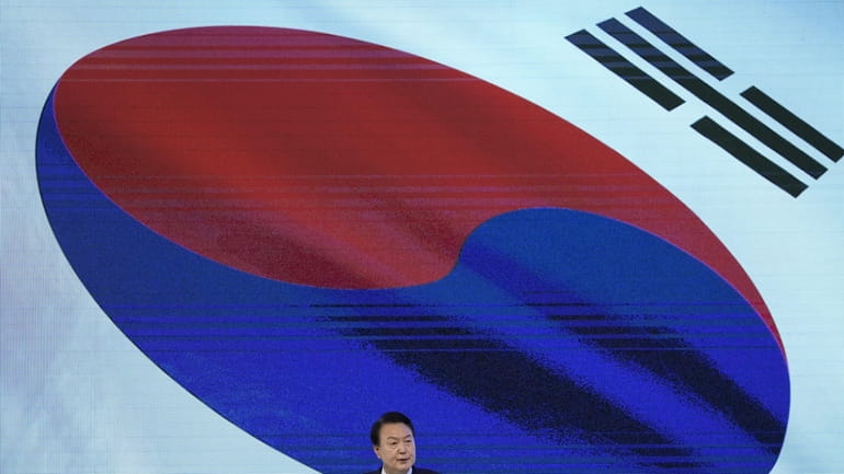 South Korean President Yoon Suk Yeol delivers a speech during...