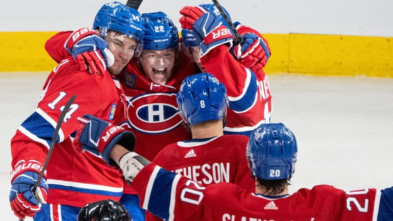 Montreal Canadiens' Nick Suzuki (14) celebrates his second goal against...