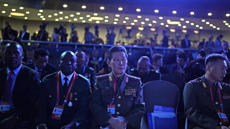 A North Korean military officer, center, attends the 10th Beijing...