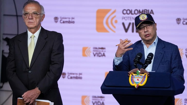 Colombia's President Gustavo Petro speaks during a press conference flanked...