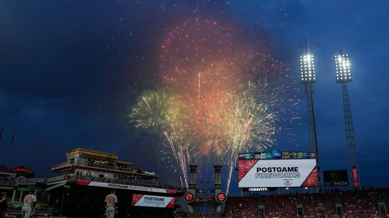 Fireworks explode above the Great American Ball Park before a...
