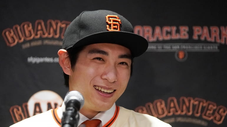 San Francisco Giants' Jung Hoo Lee speaks during a baseball...