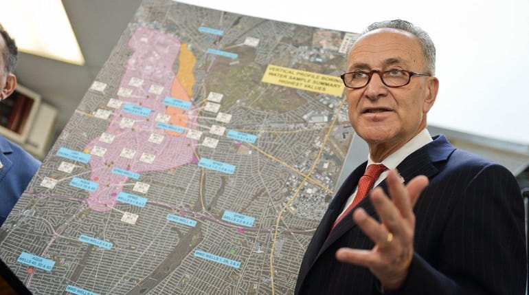 Sen. Chuck Schumer (D-N.Y.) with a map of the Bethpage...