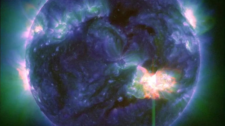 This image provided by NASA shows a solar flare, as...