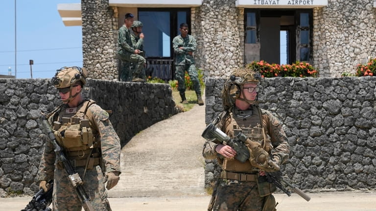 U.S. troopers secure an airport at the Philippines' northernmost town...