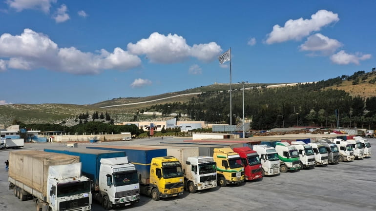 Trucks loaded with United Nations humanitarian aid for Syria following...