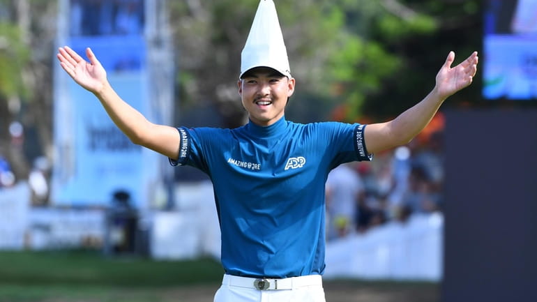 Australia's Min Woo Lee reacts after winning the Australian PGA...