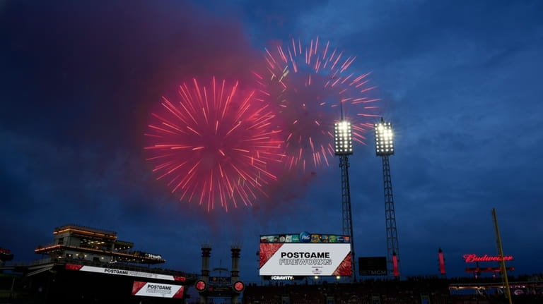 Fireworks explode above Great American Ball Park before a baseball...