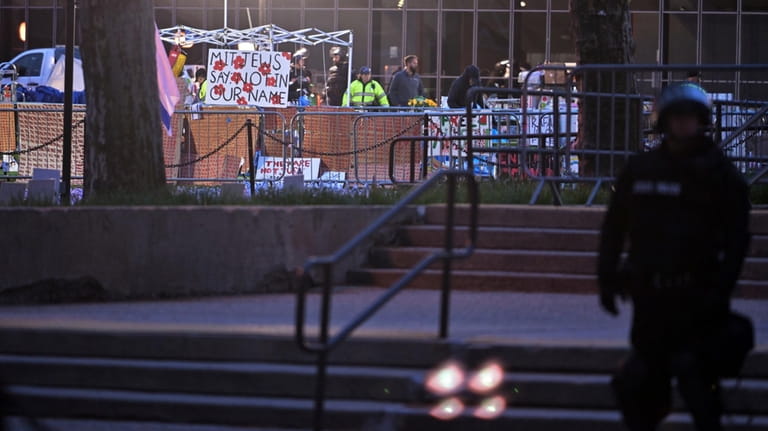 Police dismantle the pro-Palestinian encampment at MIT, before dawn Friday,...