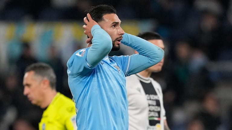 Lazio's Taty Castellanos gestures after missing a scoring chance during...