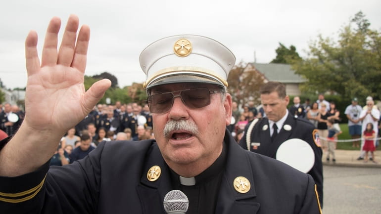 FDNY Chaplain John Delendick provided comfort to families of first responders...