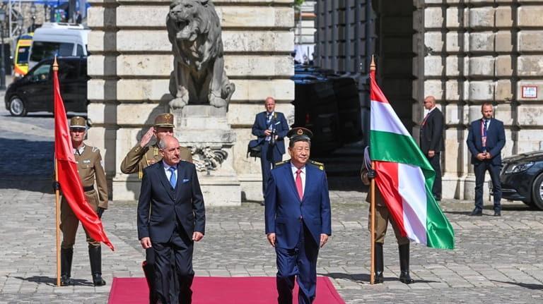 Hungarian President Tamas Sulyok, left, receives Chinese President Xi Jinping,...