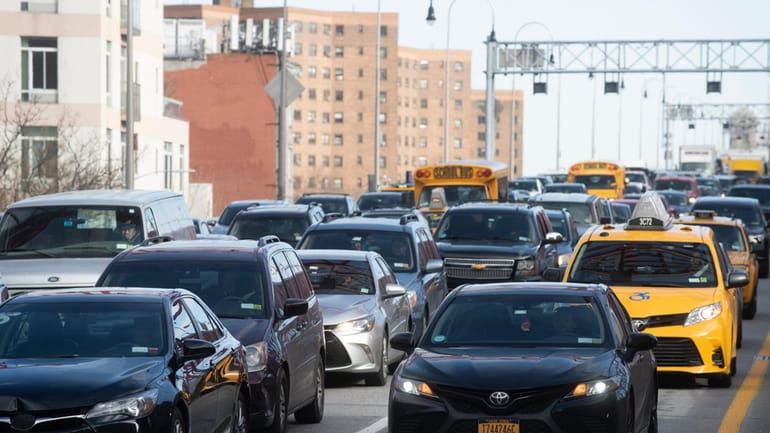 Vehicles arrive in Manhattan after crossing the Williamsburg Bridge, Manhattan,...