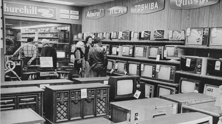 Customers shop for TVs at Friendly Frost Store at Sunrise Mall...