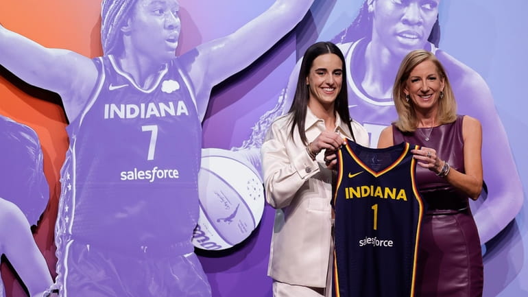 Iowa's Caitlin Clark, left, poses for a photo with WNBA...