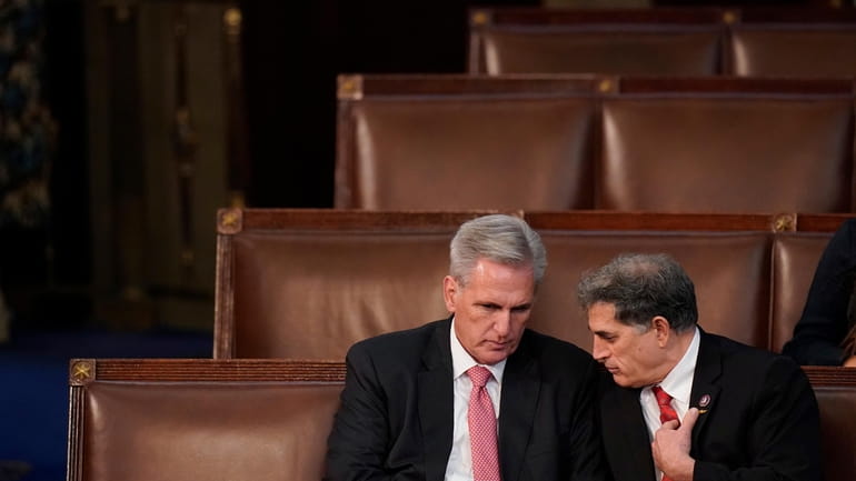 Rep. Kevin McCarthy, R-Calif., left, talks with Rep. Andrew Clyde,...