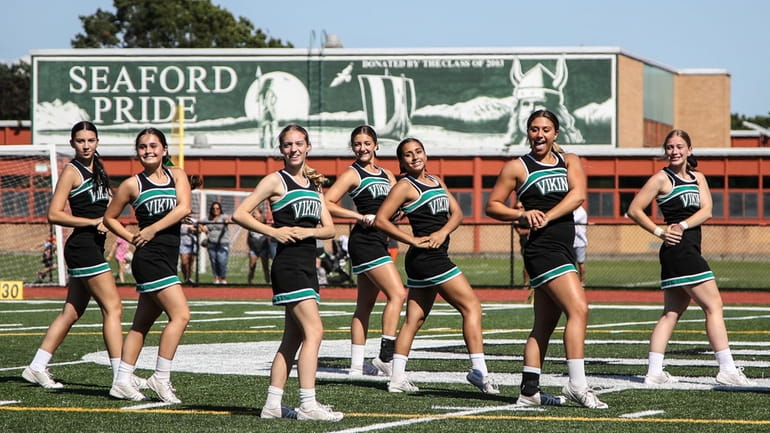 The Seaford cheerleaders entertain during halftime of the Nassau Conference...