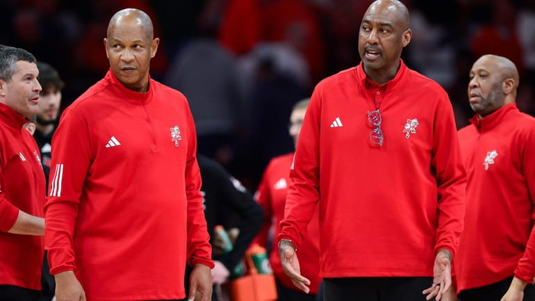 Louisville head coach Kenny Payne, left, and associate head coach...