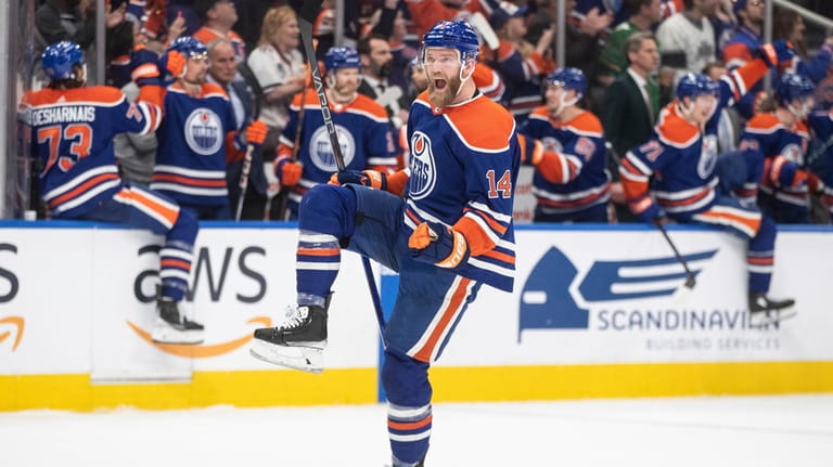 Edmonton Oilers' Mattias Ekholm (14) celebrates the win over the...