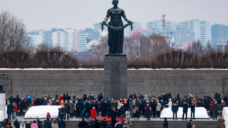 People attend a wreath laying commemoration ceremony at the Piskaryovskoye...