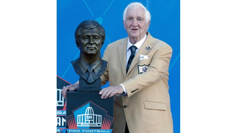 Former executive Gil Brandt poses with his Pro Football Hall...