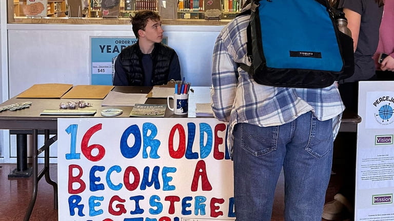 Brattleboro Union High School students register to vote during a...